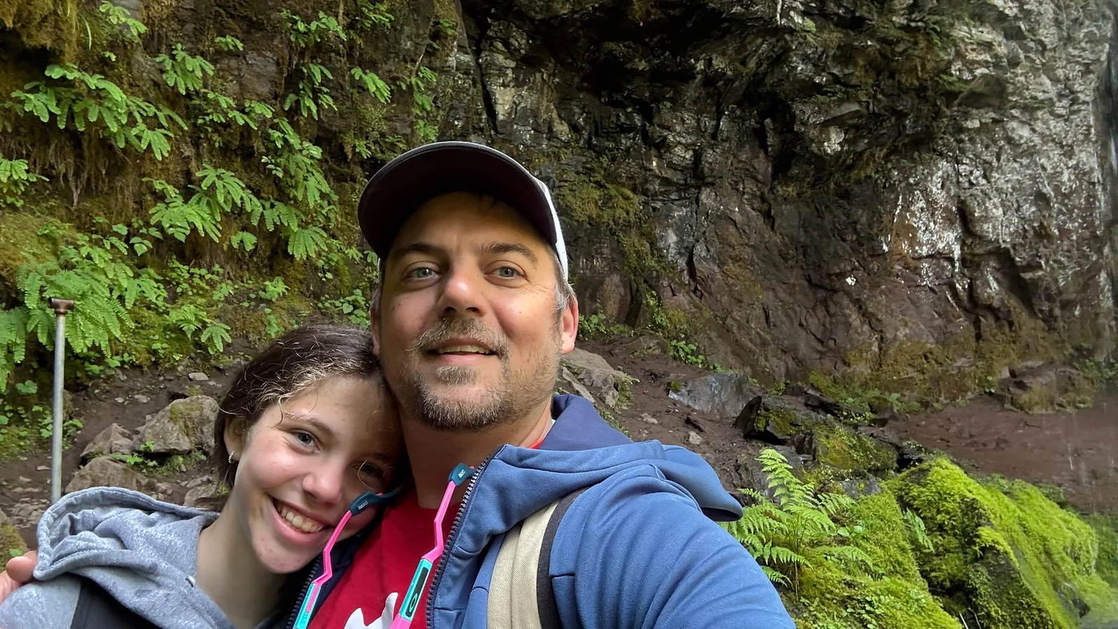 Kyle enjoying a day on a wooded trail with a companion